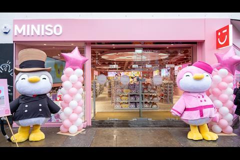 Exterior of Miniso Camden store in London, with life-size soft toys outside